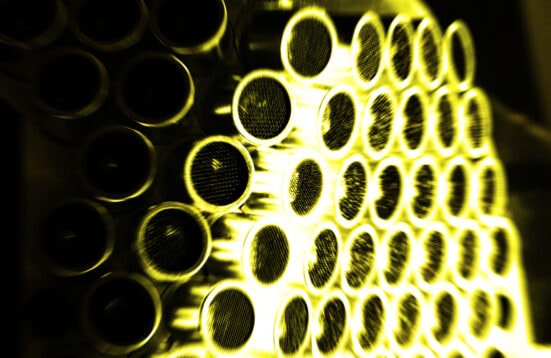 close up of a sculpture, circles with metal mesh, yellowish cat to the photograph