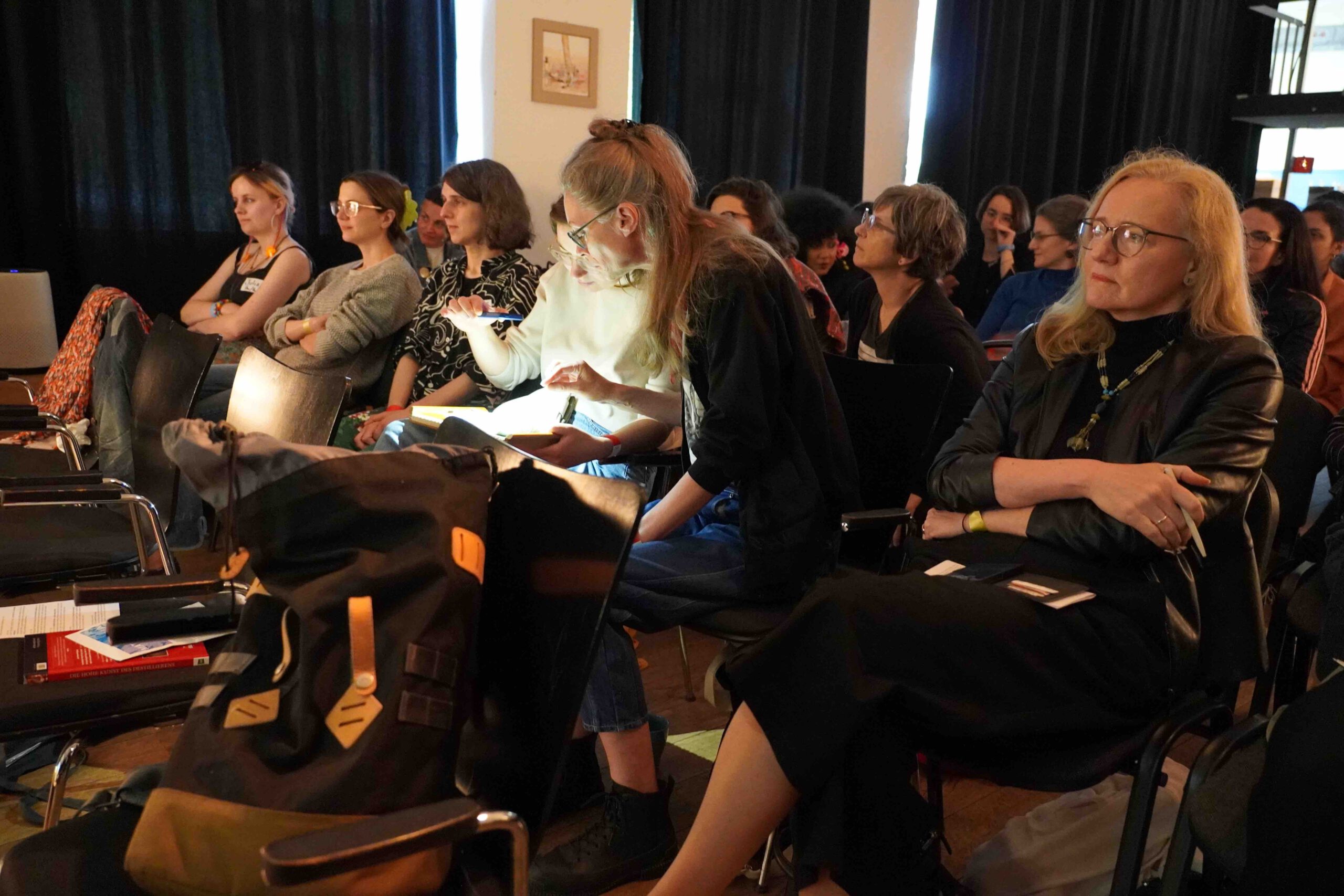 an audience listens raptly 