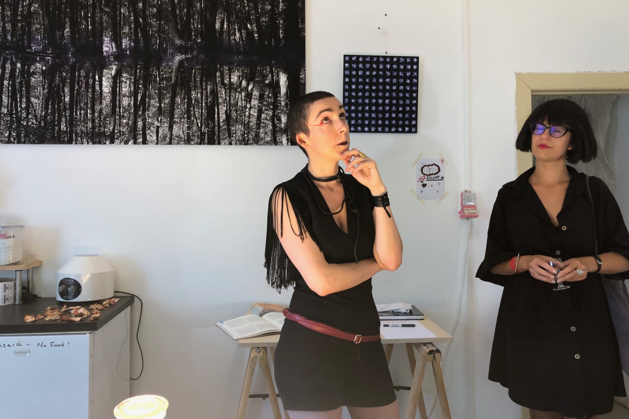 Two women standing in an artist studio