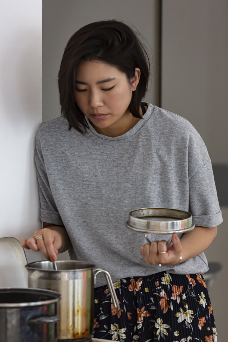 a woman stirring a pot
