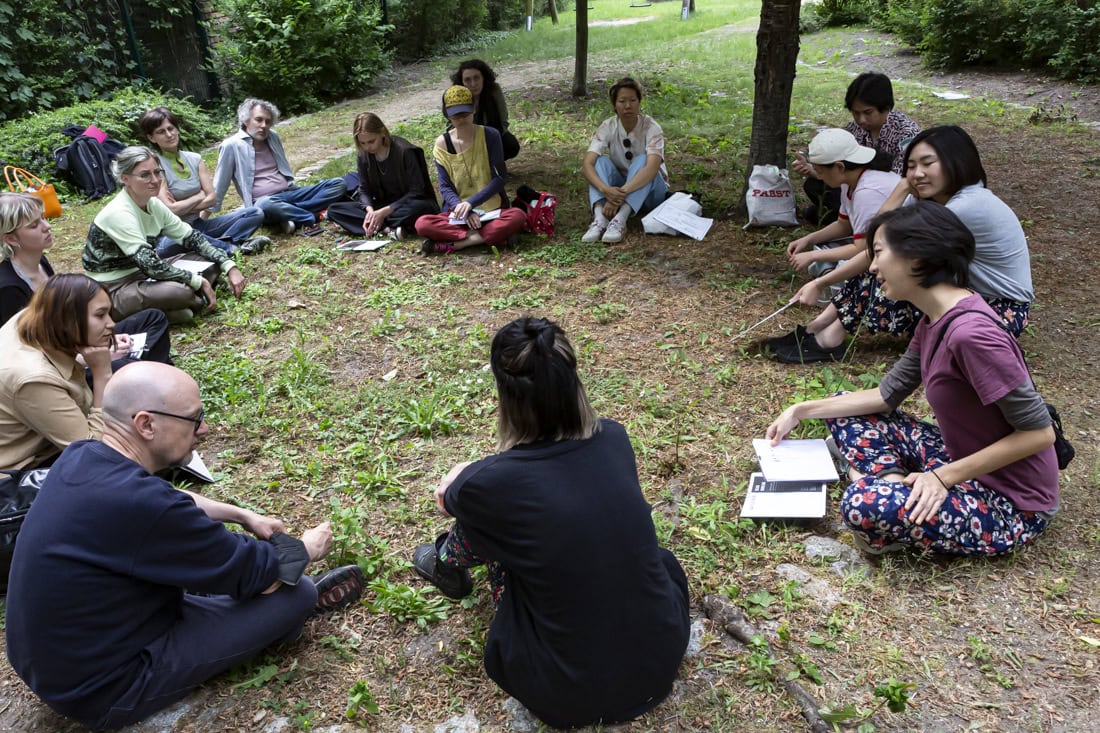 a group of people sitting in a circle