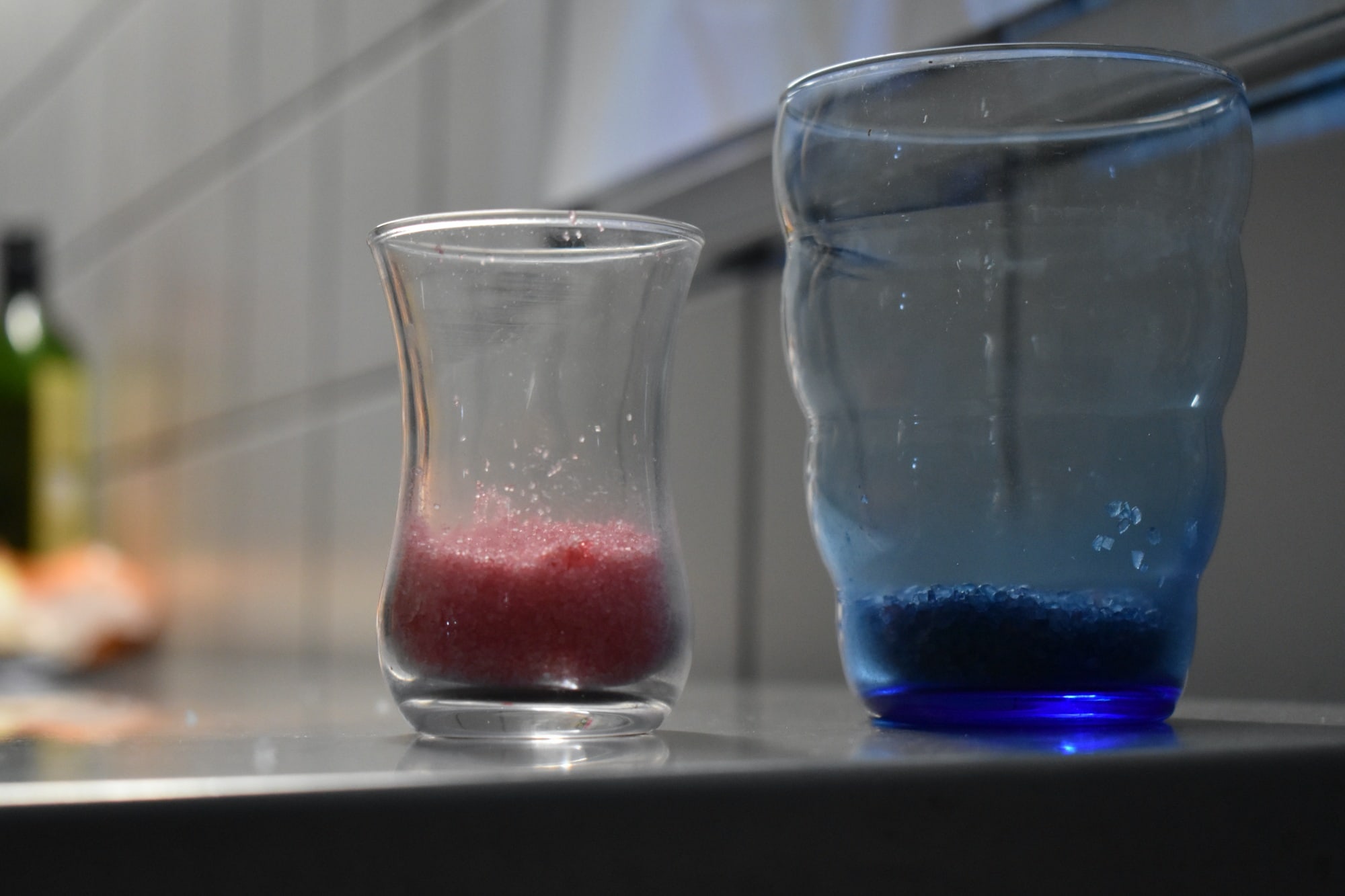 two glasses with red and blue glitter