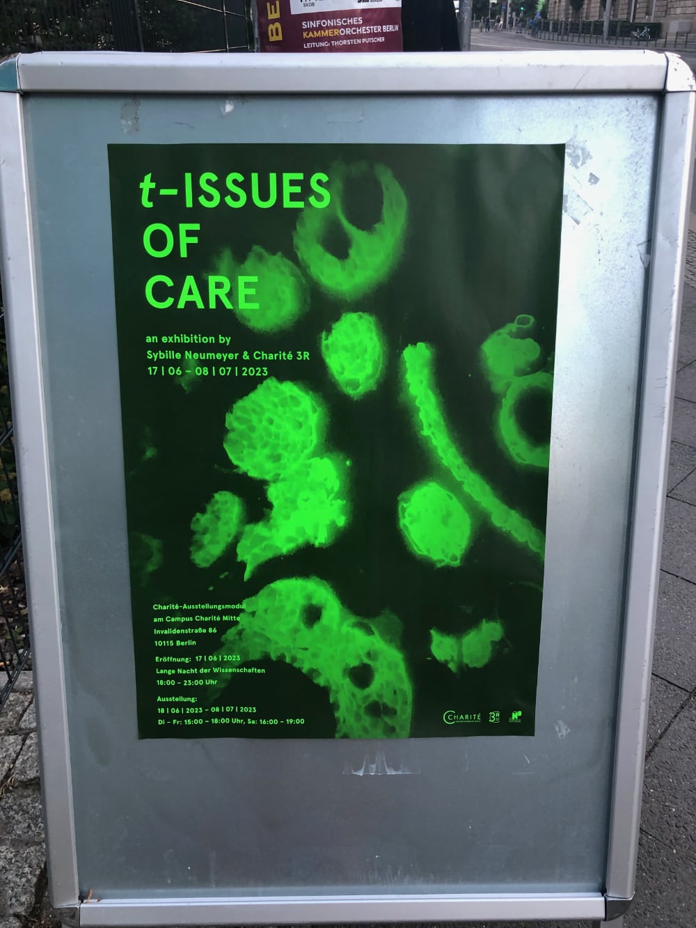 a poster with green forms and the words: t-ISSUES OF CARE