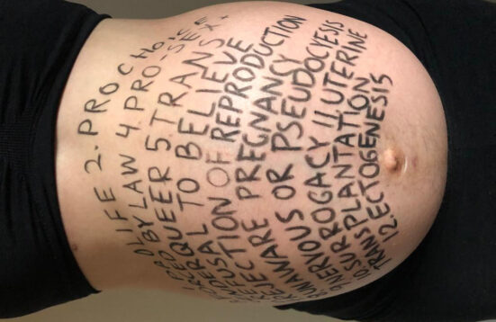 a pregnant belly with text written on it