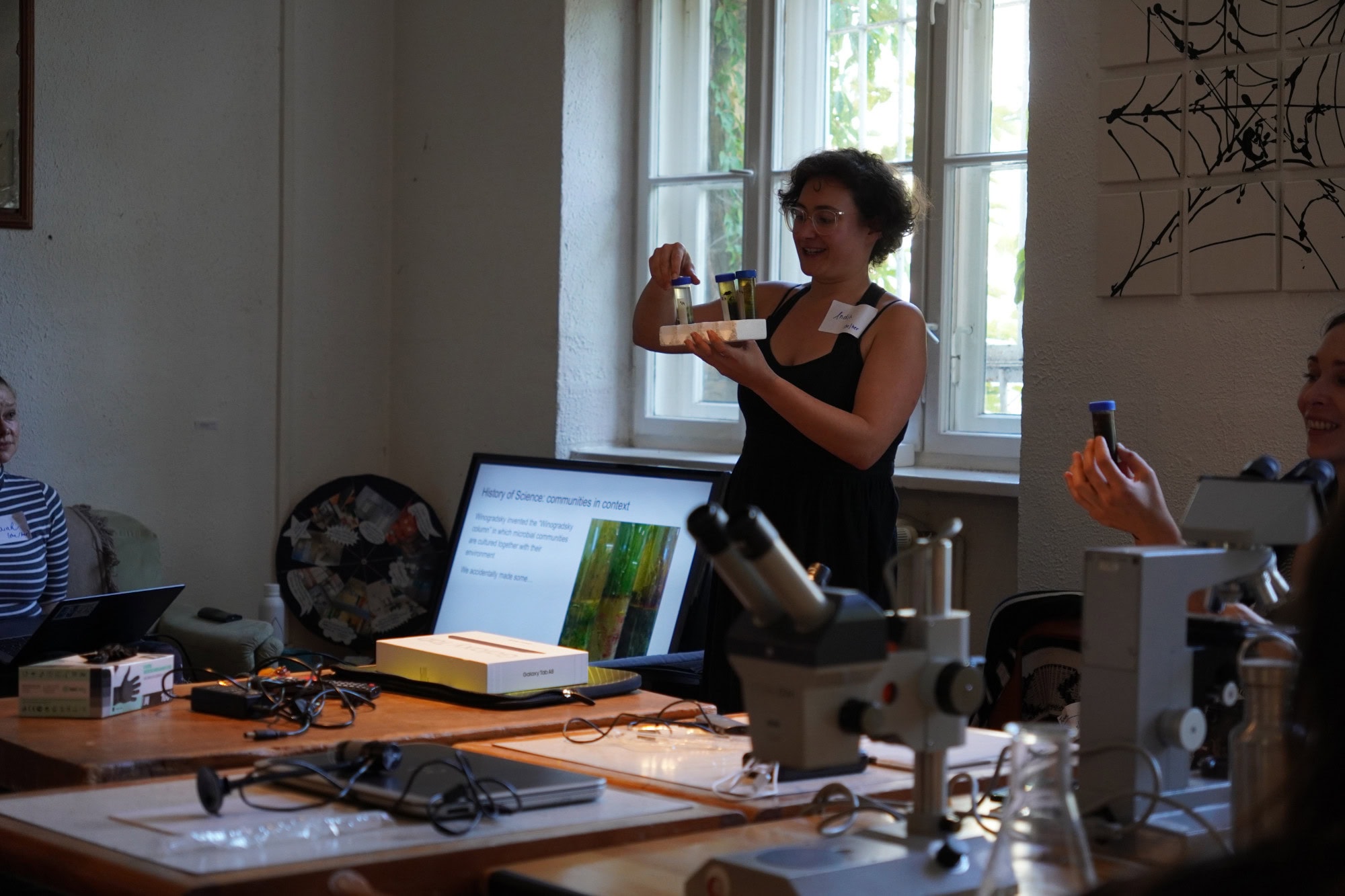 a woman holding flasks