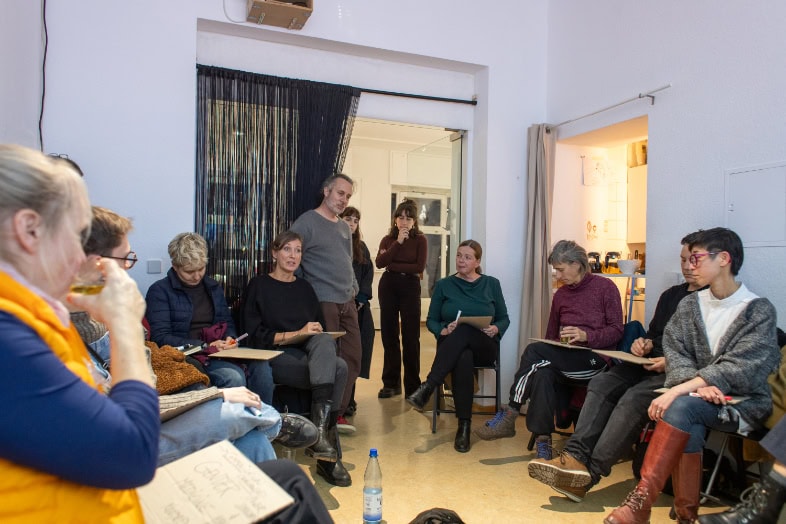 peopel in a room attending a workshop
